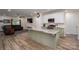 Bright, open kitchen features a marble-top island with sage green cabinets and modern, stainless-steel appliances at 3103 Richview Dr, Crouse, NC 28033