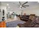 Spacious living room featuring an open floor plan, a kitchen island, and a comfortable brown leather sofa at 3103 Richview Dr, Crouse, NC 28033