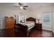 Cozy main bedroom with wood flooring, a ceiling fan, and large windows for natural light at 3103 Richview Dr, Crouse, NC 28033