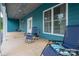 Covered front porch with a blue ceiling, blue siding, chairs and a large window at 3103 Richview Dr, Crouse, NC 28033