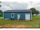 Exterior view of a matching storage shed with garage door and window at 3103 Richview Dr, Crouse, NC 28033