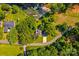 An aerial view shows the property with lake access, mature trees, and a well-maintained lawn at 315 Wood Duck Loop, Mooresville, NC 28117