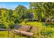 Beautiful backyard with a dock, wooden stairs to the house and a fenced yard at 315 Wood Duck Loop, Mooresville, NC 28117