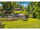 Picturesque backyard featuring a private lake, lush greenery, and a dock at 315 Wood Duck Loop, Mooresville, NC 28117