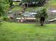 Spacious backyard leading to the water with multiple docks and boats ready for lake enjoyment at 315 Wood Duck Loop, Mooresville, NC 28117