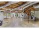 Spacious basement with exposed ceiling, concrete floors, and natural light at 315 Wood Duck Loop, Mooresville, NC 28117