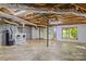 Unfinished basement area with laundry hookups and ample space at 315 Wood Duck Loop, Mooresville, NC 28117