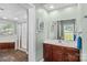 Well-lit bathroom with separate shower, soaking tub, spacious vanity, and attractive marble flooring at 315 Wood Duck Loop, Mooresville, NC 28117