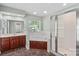 Well-lit bathroom with separate shower, soaking tub, spacious vanity, and attractive marble flooring at 315 Wood Duck Loop, Mooresville, NC 28117