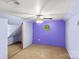 Unique bedroom with slanted ceilings, a ceiling fan, and a carpeted floor at 315 Wood Duck Loop, Mooresville, NC 28117