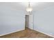 Cozy bedroom with neutral carpet and a classic light fixture at 315 Wood Duck Loop, Mooresville, NC 28117