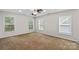 Bright bedroom with large windows, ample natural light, and neutral carpet flooring for comfort and style at 315 Wood Duck Loop, Mooresville, NC 28117