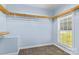 Walk-in closet with built-in shelving and a bright window, offering ample storage and natural light at 315 Wood Duck Loop, Mooresville, NC 28117