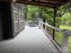Relaxing outdoor deck featuring views of mature landscaping, a hot tub, and space for entertainment at 315 Wood Duck Loop, Mooresville, NC 28117