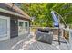 Relaxing backyard deck equipped with a hot tub and umbrella for shaded relaxation at 315 Wood Duck Loop, Mooresville, NC 28117