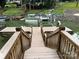 View from the dock and staircase leading to the lake, as well as neighborhood docks and boat parking at 315 Wood Duck Loop, Mooresville, NC 28117