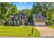 Charming two-story home with a lush green lawn, a separate garage, and a welcoming curb appeal at 315 Wood Duck Loop, Mooresville, NC 28117