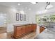 This kitchen features a granite topped island with a cooktop, modern fixtures, and recessed lighting at 315 Wood Duck Loop, Mooresville, NC 28117