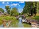 Picturesque lake view with boats docked and lush greenery along the water's edge at 315 Wood Duck Loop, Mooresville, NC 28117