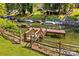 Picturesque lake view with boats docked and lush greenery along the water's edge at 315 Wood Duck Loop, Mooresville, NC 28117