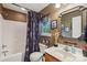 This bathroom features unique decor, a shower with tub, and vanity storage at 320 Bluegill Ln, Statesville, NC 28625