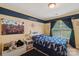 This bedroom has a fun nautical theme and plenty of room to play at 320 Bluegill Ln, Statesville, NC 28625