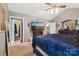 This main bedroom includes a sitting area, TV, and ensuite bathroom at 320 Bluegill Ln, Statesville, NC 28625