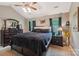 Spacious main bedroom features dark furniture, neutral walls, and natural light at 320 Bluegill Ln, Statesville, NC 28625