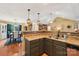 Open concept kitchen features bar seating and a view into the dining area at 320 Bluegill Ln, Statesville, NC 28625