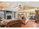 Comfortable living room features a fireplace, hardwood floors, and an open layout to the kitchen at 320 Bluegill Ln, Statesville, NC 28625