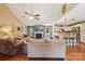 Spacious living area offers hardwood floors, a fireplace, and seamless flow to the kitchen at 320 Bluegill Ln, Statesville, NC 28625