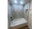 Modern bathroom featuring a marble-tiled shower with black shower head and a built-in niche at 39 E White St, Chester, SC 29706
