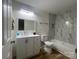 Modern bathroom featuring new vanity with white countertop and updated tub with marble tiled wall at 39 E White St, Chester, SC 29706