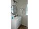Well-lit bathroom vanity features a modern sink, oval mirror, and chrome fixtures and hardware at 39 E White St, Chester, SC 29706