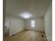 Bright bedroom with wood-look flooring, neutral walls, and plenty of natural light at 39 E White St, Chester, SC 29706