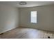 Comfortable bedroom featuring wood-look floors and a window with lots of natural light at 39 E White St, Chester, SC 29706