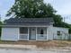 Charming single-story home with a welcoming front porch and newly installed siding at 39 E White St, Chester, SC 29706