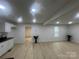 Spacious living room with modern flooring, recessed lighting, and freshly painted walls at 39 E White St, Chester, SC 29706