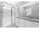 Modern bathroom with dual sinks, granite counters and a glass-enclosed shower at 3902 Mcgee Point Rd, Terrell, NC 28682