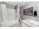 Clean bathroom featuring a shower-tub combo, granite countertops, and tiled floors at 3902 Mcgee Point Rd, Terrell, NC 28682