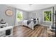 Bright bedroom with hardwood floors, large windows, and cozy decor at 3902 Mcgee Point Rd, Terrell, NC 28682