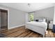 Comfortable bedroom featuring hardwood floors, a window, and neutral decor at 3902 Mcgee Point Rd, Terrell, NC 28682