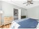 Comfortable bedroom boasts a trey ceiling, a ceiling fan and an ensuite bath at 3902 Mcgee Point Rd, Terrell, NC 28682