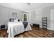 Serene bedroom with hardwood floors, soft lighting, and comfortable furnishings at 3902 Mcgee Point Rd, Terrell, NC 28682