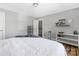 Cozy bedroom features decor on shelves, hardwood floors, and a comfortable bedspread at 3902 Mcgee Point Rd, Terrell, NC 28682