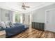 Inviting bedroom with tray ceiling, ceiling fan, outside access and soothing decor at 3902 Mcgee Point Rd, Terrell, NC 28682