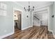 Bright dining room with hardwood floors, a modern chandelier, and open access to kitchen at 3902 Mcgee Point Rd, Terrell, NC 28682
