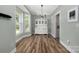 Open dining area with hardwood floors, a bay window and a classic white hutch at 3902 Mcgee Point Rd, Terrell, NC 28682