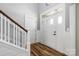 Bright foyer with hardwood floors and a staircase leading to the upper level at 3902 Mcgee Point Rd, Terrell, NC 28682