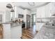 Modern kitchen featuring white cabinets, granite countertops, and stainless steel appliances at 3902 Mcgee Point Rd, Terrell, NC 28682